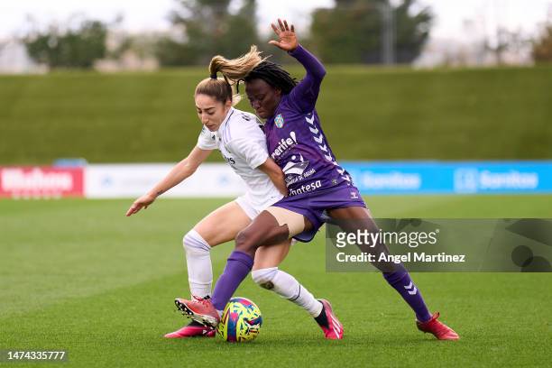 Olga Carmona of Real Madrid competes for the ball with Koko Ange N'Guessan of UDG Tenerife during the Liga F match between Real Madrid and UDG...