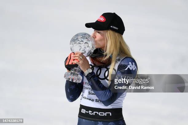 Mikaela Shiffrin of United States celebrates with the Crystal Globe trophy after winning the Slalom World Cup at the Audi FIS Alpine Ski World Cup...