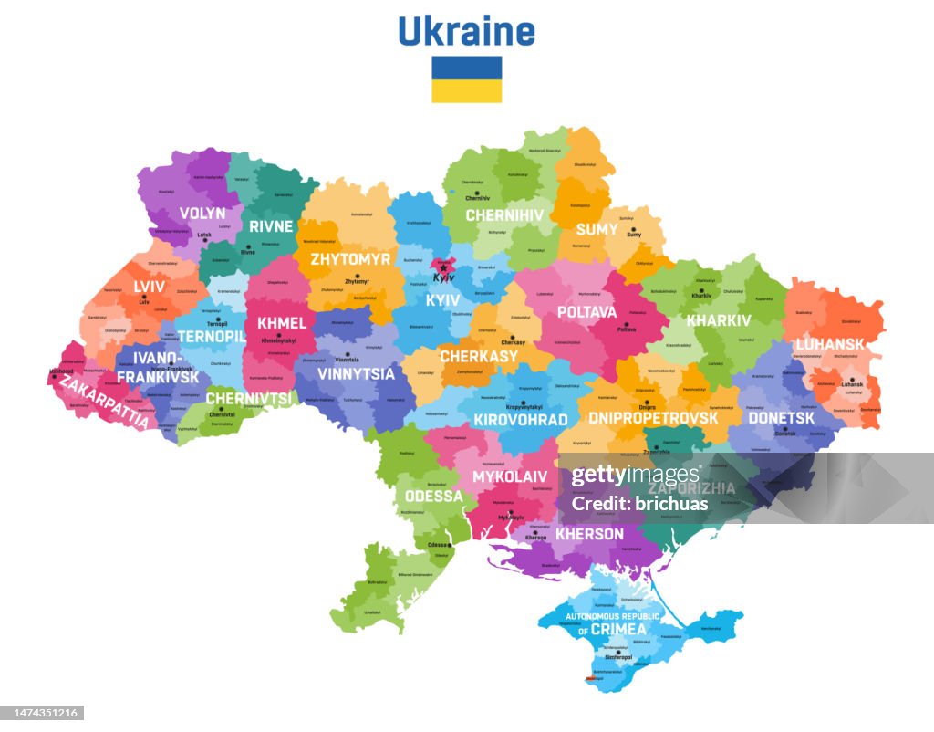 Ukraine map colored by administrative divisions (oblasts and raions) with inscriptions and capital cities. Flag of Ukraine