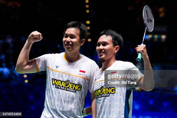 Mohammad Ahsan and Hendra Setiawan of Indonesia celebrate the victory in the Men's Doubles semi finals match against Liang Weikeng and Wang Chang of...