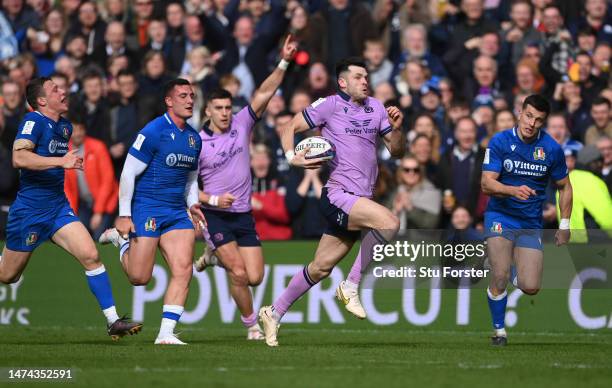 Blair Kinghorn of Scotland breaks to score the fourth Scotland try during the Six Nations Rugby match between Scotland and Italy at Murrayfield...