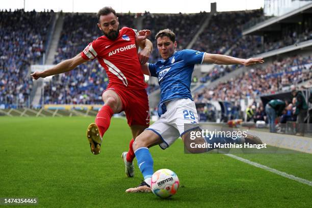 Robert Skov of TSG Hoffenheim is challenged by Lucas Tousart of Hertha Berlin during the Bundesliga match between TSG Hoffenheim and Hertha BSC at...