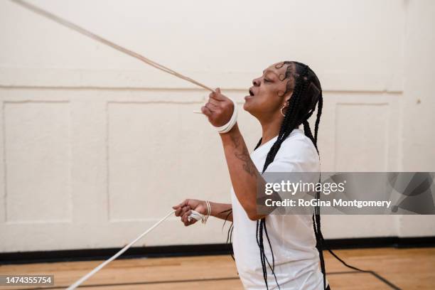 middle age african-american women exercising - double-dutch-skipping stock pictures, royalty-free photos & images
