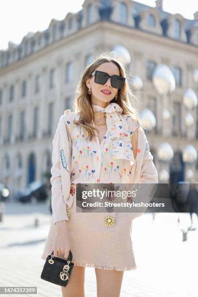 Alexandra Lapp is seen MAISON COMMON light knit balloon cardigan in creme, MAISON COMMON easy silk shell balloon print top in creme, MAISON COMMON...