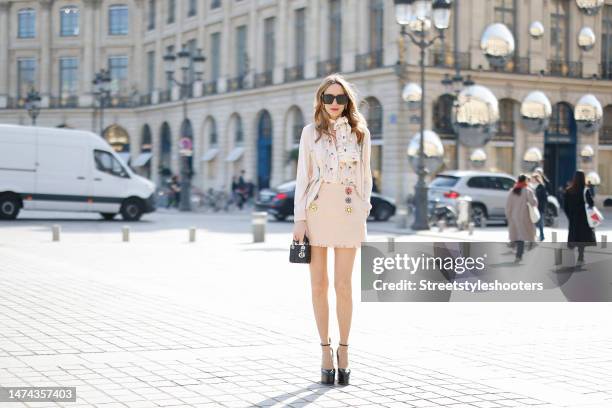 Alexandra Lapp is seen MAISON COMMON light knit balloon cardigan in creme, MAISON COMMON easy silk shell balloon print top in creme, MAISON COMMON...