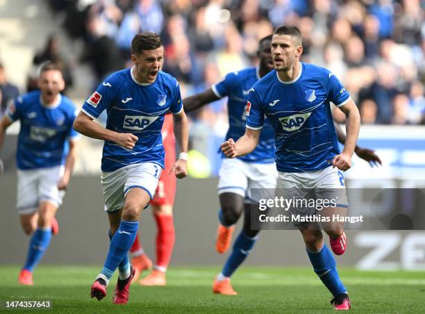 Andrej Kramaric of TSG Hoffenheim celebrates after scoring the team's second goal from a penalty kick with teammates during the Bundesliga match...