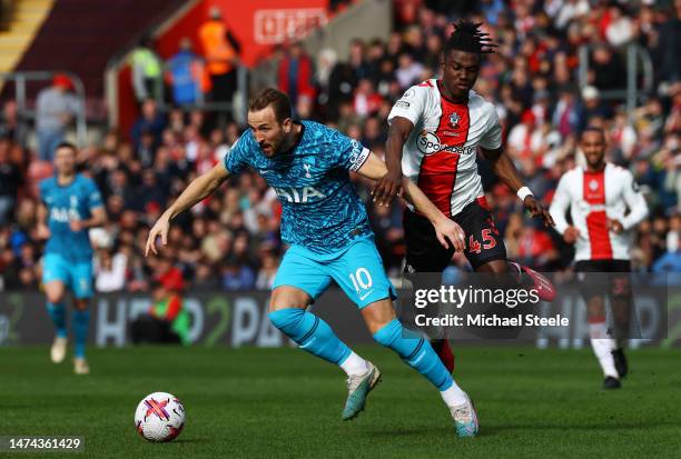 Harry Kane of Tottenham Hotspur is put under pressure by Romeo Lavia of Southampton during the Premier League match between Southampton FC and...