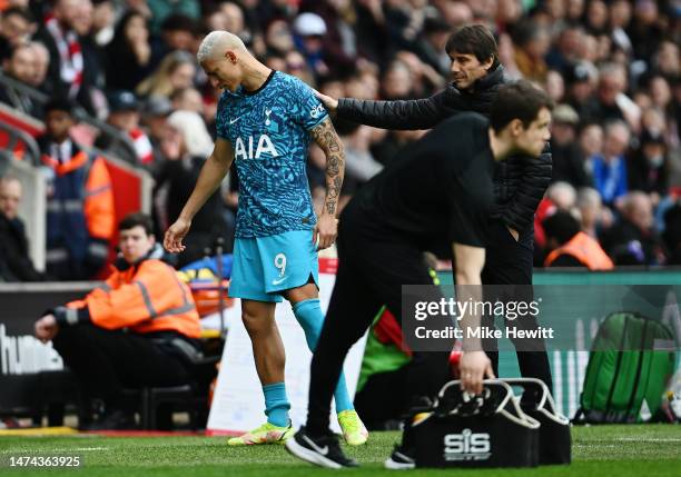 Richarlison of Tottenham Hotspur is embraced by Antonio Conte, Manager of Tottenham Hotspur, after being substituted off during the Premier League...