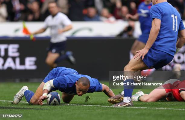 Gael Fickou of France scores their side's fourth try during the Six Nations Rugby match between France and Wales at Stade de France on March 18, 2023...