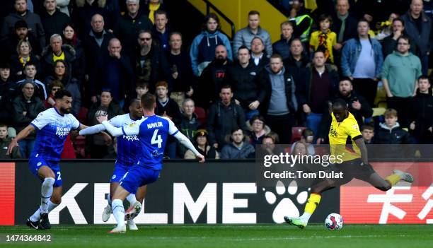 Keinan Davis of Watford scores the opening goal during the Sky Bet Championship between Watford and Wigan Athletic at Vicarage Road on March 18, 2023...