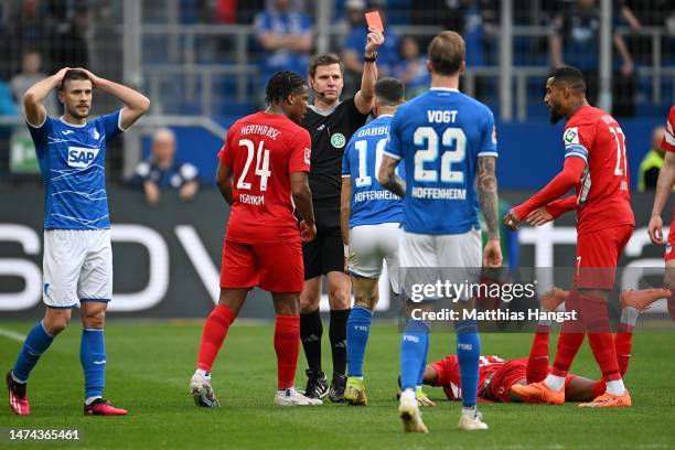 Munas Dabbur of TSG Hoffenheim receives a red card from Referee Frank Willenborg during the Bundesliga match between TSG Hoffenheim and Hertha BSC at...