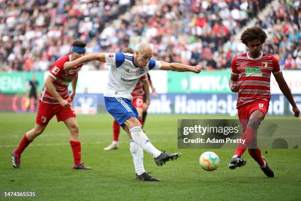 Michael Frey of FC Schalke 04 shoots and misses during the Bundesliga match between FC Augsburg and FC Schalke 04 at WWK-Arena on March 18, 2023 in...