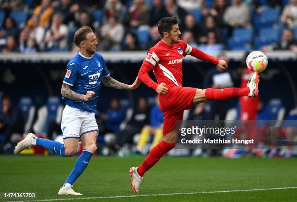 Stevan Jovetic of Hertha Berlin controls the ball whilst under pressure from Kevin Vogt of TSG Hoffenheim during the Bundesliga match between TSG...