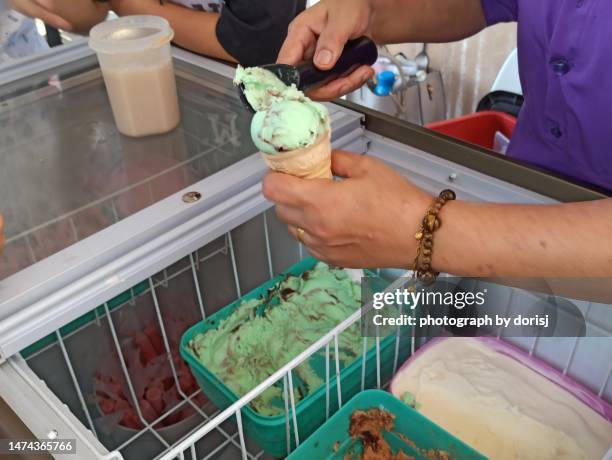 mint chocolate chip ice cream cone - mint ice cream stock pictures, royalty-free photos & images