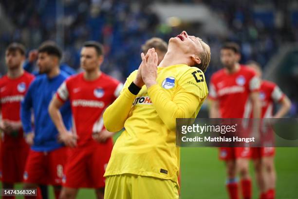 Oliver Christensen of Hertha Berlin reacts after the Bundesliga match between TSG Hoffenheim and Hertha BSC at PreZero-Arena on March 18, 2023 in...