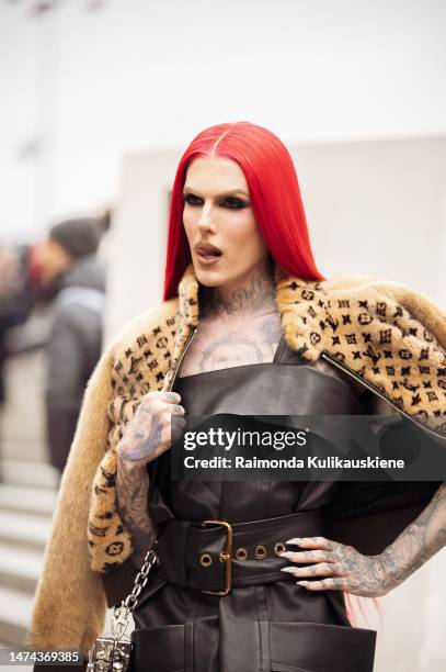 Jeffree Star is seen wearing a brown fur coat, Louis Vuitton jacket, black skirt and silver chain bag outside the Louis Vuitton show during Paris...