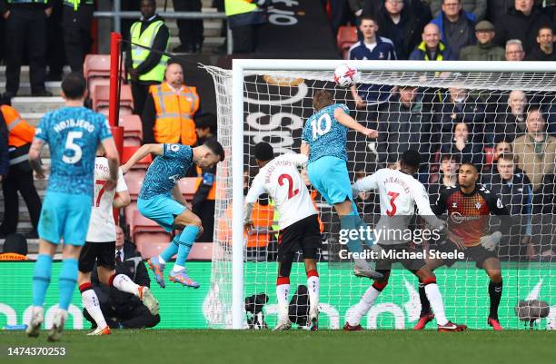 Harry Kane of Tottenham Hotspur scores the team's second goal past Gavin Bazunu of Southampton during the Premier League match between Southampton FC...