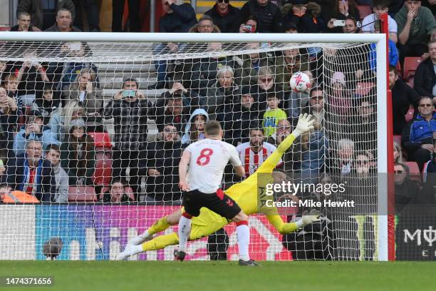 James Ward-Prowse of Southampton scores the team's third goal past Fraser Forster of Tottenham Hotspur from a penalty kick during the Premier League...