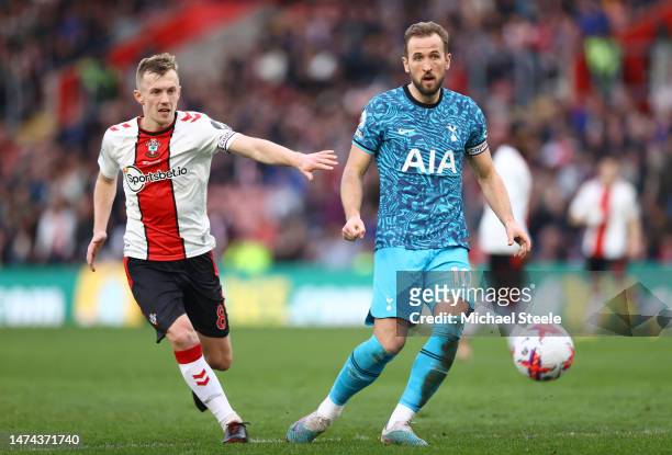 Harry Kane of Tottenham Hotspur passes the ball while under pressure from James Ward-Prowse of Southampton during the Premier League match between...