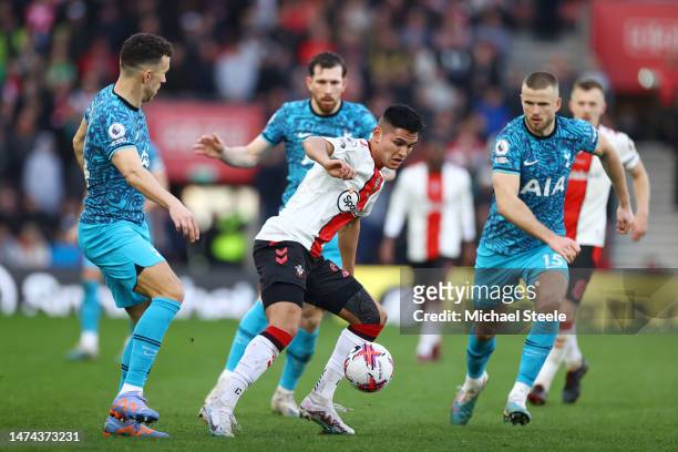 Carlos Alcaraz of Southampton is put under pressure by Ivan Perisic and Eric Dier of Tottenham Hotspur during the Premier League match between...