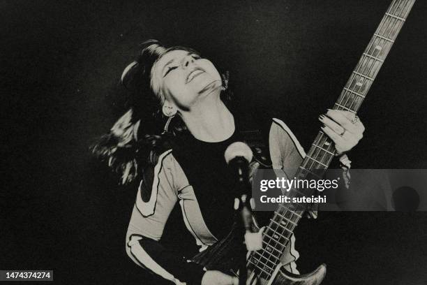 the young female rock musician. - popular music concert stock pictures, royalty-free photos & images