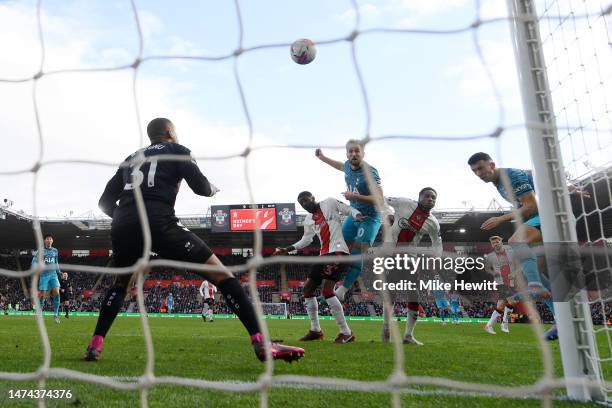 Harry Kane of Tottenham Hotspur scores the team's second goal past Gavin Bazunu of Southampton during the Premier League match between Southampton FC...