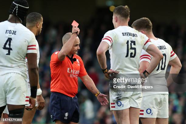 Referee Freddie Steward of England receives a red card from Referee Jaco Peyper during the Six Nations Rugby match between Ireland and England at...