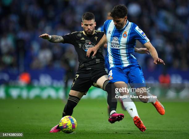 Carles Perez of RC Celta and Leandro Cabrera of RCD Espanyol battle for the ball during the LaLiga Santander match between RCD Espanyol and RC Celta...