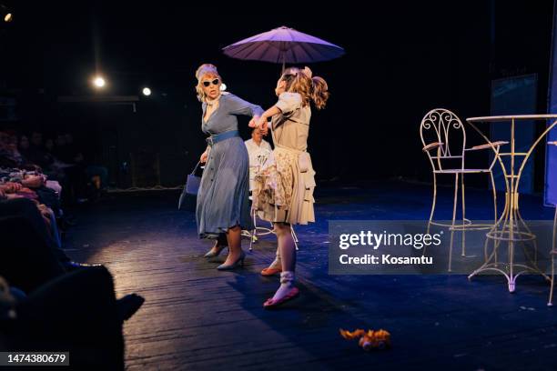 A Group Of Professional Actors Perform A Theatrical Performance In ...