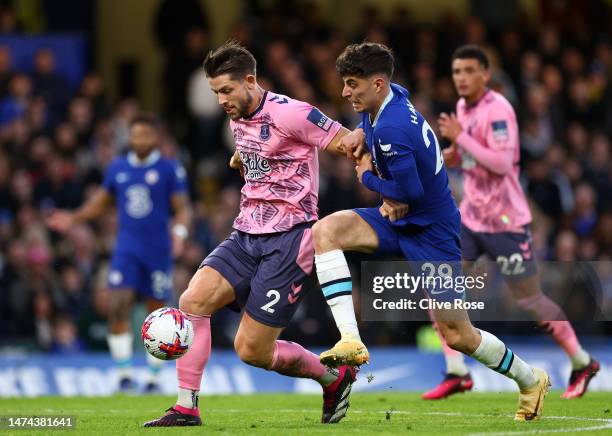 James Tarkowski of Everton is challenged by Kai Havertz of Chelsea during the Premier League match between Chelsea FC and Everton FC at Stamford...