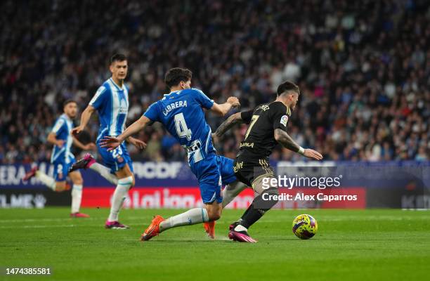 Carles Perez of RC Celta is challenged by Leandro Cabrera of RCD Espanyol and results in a penalty during the LaLiga Santander match between RCD...