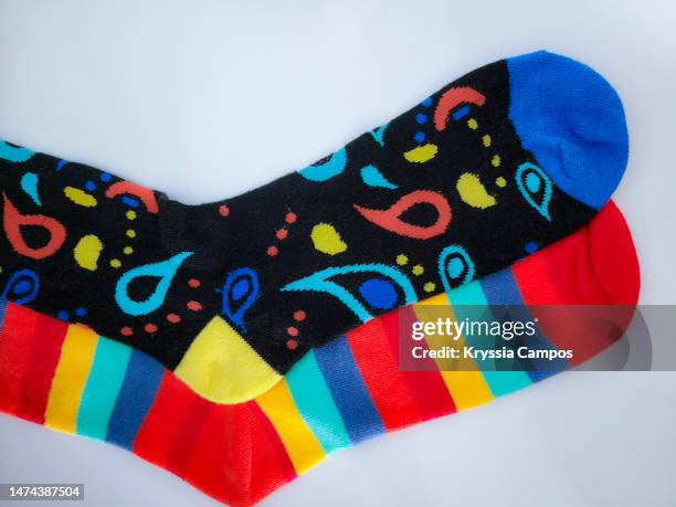 mismatched pair of socks - crazy socks stock pictures, royalty-free photos & images