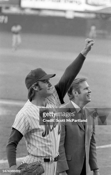 American baseball player Rusty Staub , of the New York Mets, raises his fist towards fans during a game at Shea Stadium, in Queens' Corona...