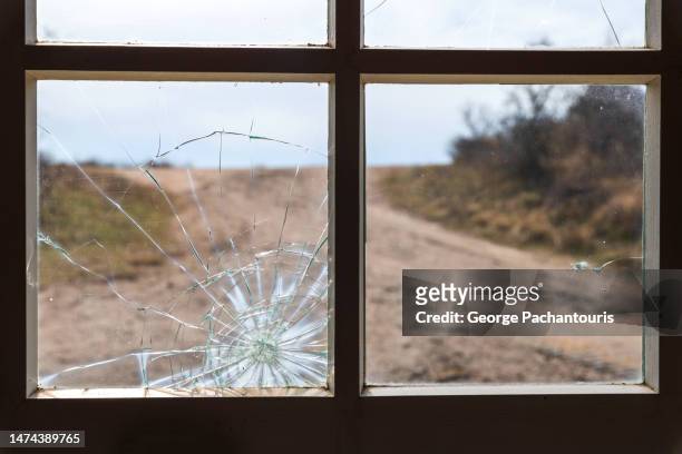 broken glass of a home window - abandoned crack house stock pictures, royalty-free photos & images