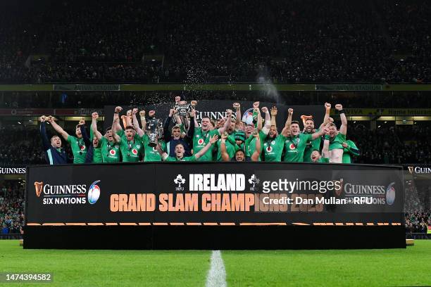 Johnny Sexton of Ireland lifts the Six Nations Trophy as James Ryan of Ireland lifts the Triple Crown Trophy after winning the Six Nations with a...