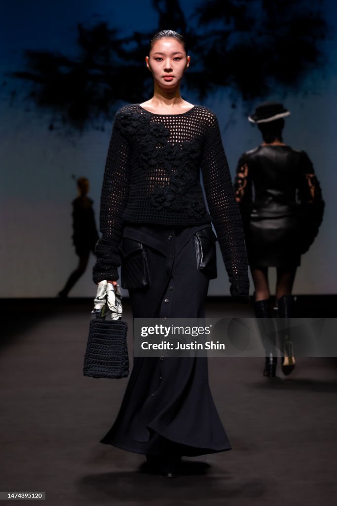 A model walks the runway during the JULYCOLUMN show at Seoul Fashion ...