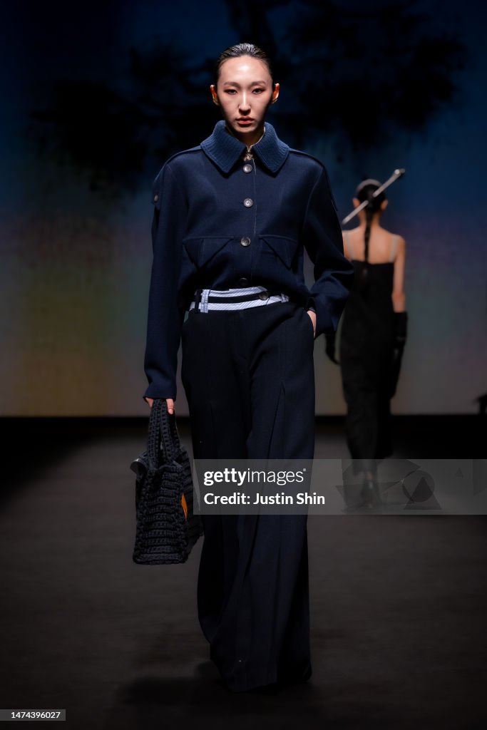 A model walks the runway during the JULYCOLUMN show at Seoul Fashion ...