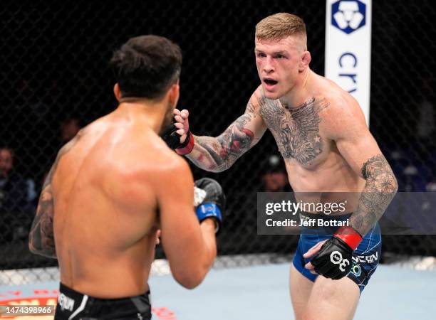 Chris Duncan of Scotland battles Omar Morales of Venezuela in a lightweight fight during the UFC 286 event at The O2 Arena on March 18, 2023 in...