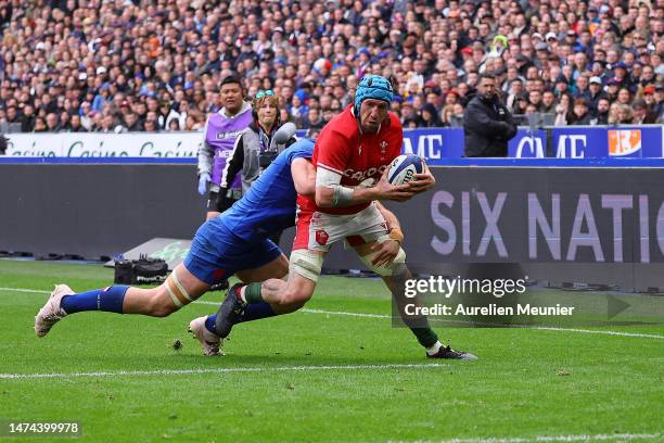 Dafydd Jenkins of Wales is tackled during the Six Nations Rugby match between France and Wales at Stade de France on March 18, 2023 in Paris, France.