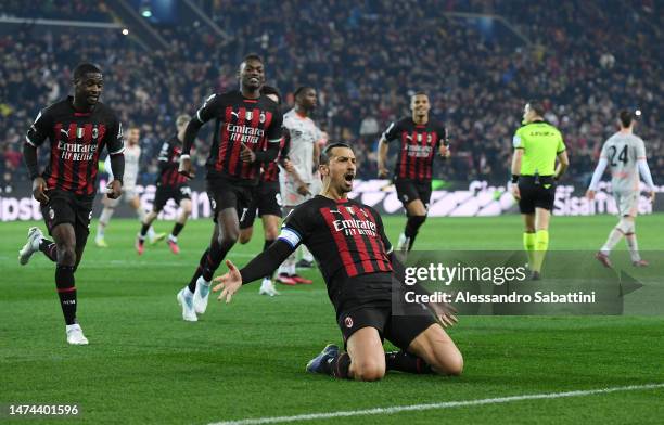 Zlatan Ibrahimovic of AC Milan celebrates after scoring the team's first goal from a penalty kick during the Serie A match between Udinese Calcio and...