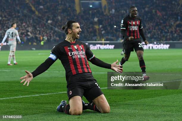 Zlatan Ibrahimovic of AC Milan celebrates after scoring the team's first goal from a penalty kick during the Serie A match between Udinese Calcio and...