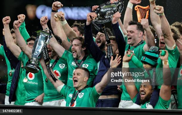 Johnny Sexton, the Ireland captain, holds the Six Nations trophy as Ireland celebrate their Grand Slam victory during the Six Nations Rugby match...
