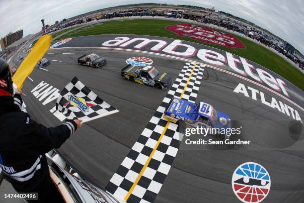 Christian Eckes, driver of the NAPA AutoCare Chevrolet, takes the checkered flag under caution to win the NASCAR Craftsman Truck Series Fr8 208 at...