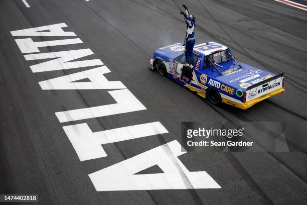 Christian Eckes, driver of the NAPA AutoCare Chevrolet, celebrates after winning the NASCAR Craftsman Truck Series Fr8 208 at Atlanta Motor Speedway...