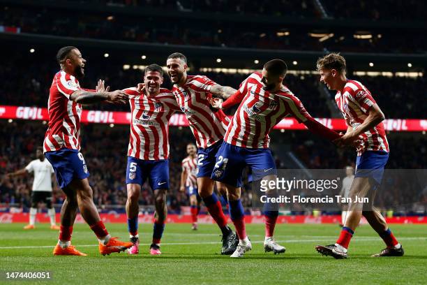 Yannick Ferreira Carrasco of Atletico Madrid celebrates after scoring the team's second goal with teammates during the LaLiga Santander match between...