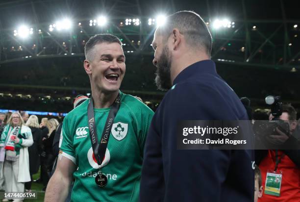 Johnny Sexton, the Ireland captain, laughs with head coach Andy Farrell after their Grand Slam victory during the Six Nations Rugby match between...