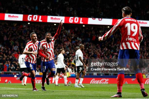 Thomas Lemar of Atletico Madrid celebrates after scoring the team's third goal with teammates during the LaLiga Santander match between Atletico de...