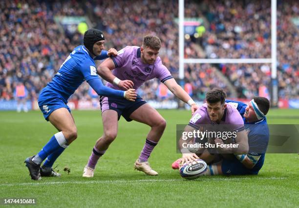 Blair Kinghorn of Scotland dives over to score the third Scotland try during the Six Nations Rugby match between Scotland and Italy at Murrayfield...