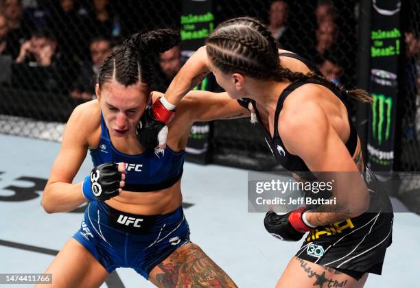 Jennifer Maia of Brazil punches Casey O'Neill of Scotland in a flyweight fight during the UFC 286 event at The O2 Arena on March 18, 2023 in London,...