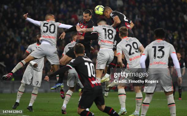 Malick Thiaw of AC Milan heads the ball from a cross during the Serie A match between Udinese Calcio and AC Milan at the Dacia Arena on March 18,...